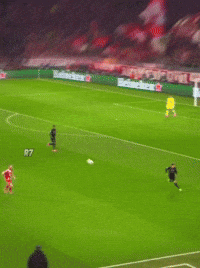 A Soccer Player In A Red T-Mobile Jersey Is Running Towards The Ball GIF