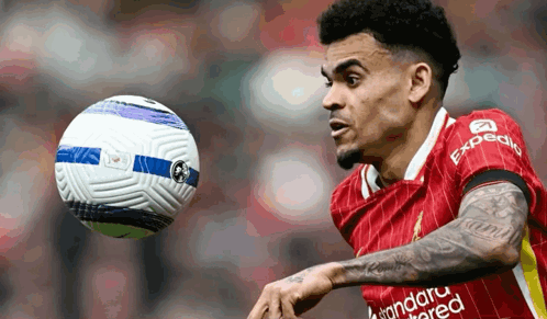 A Soccer Player In A Red Uniform With Expedia Written On His Jersey GIF