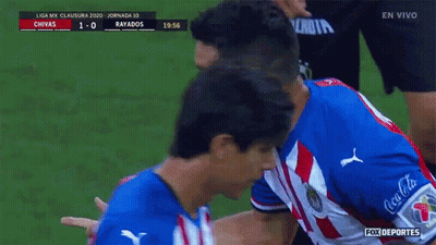A Soccer Player In A Red White And Blue Uniform Is Being Congratulated GIF