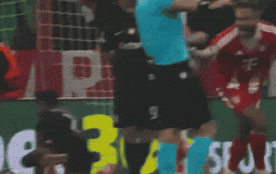 A Soccer Player In A T-Mobile Jersey Is Being Tackled GIF