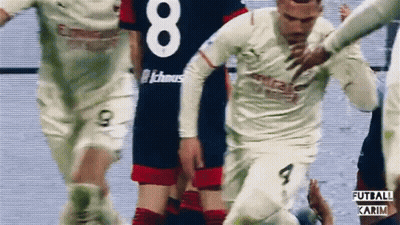 A Soccer Player In A White Jersey With The Number 8 On It GIF