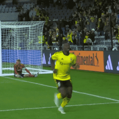 A Soccer Player In A Yellow Adidas Jersey Runs Towards The Goal GIF
