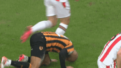 A Soccer Player In A Yellow And Black Striped Jersey With The Number 5 On The Back GIF