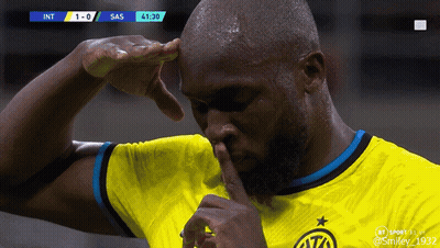 A Soccer Player In A Yellow Jersey Holds His Finger To His Nose GIF