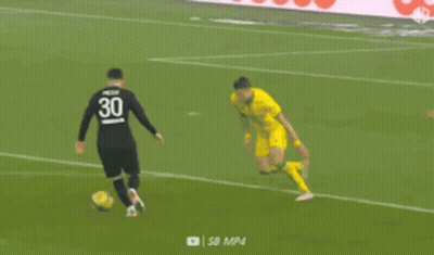 A Soccer Player In A Yellow Jersey Is Kicking A Soccer Ball On A Soccer Field . GIF