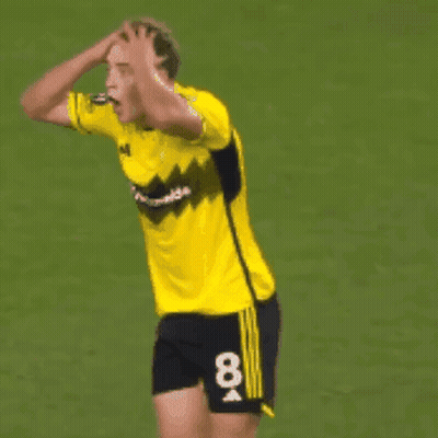 A Soccer Player In A Yellow Jersey With The Number 19 On The Back GIF
