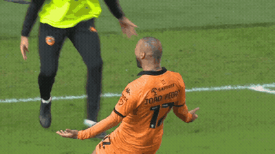 A Soccer Player In An Orange Jersey With The Number 7 On The Back GIF