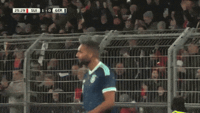 A Soccer Player Is Celebrating A Goal During A Game GIF
