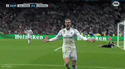 A Soccer Player Is Celebrating A Goal During A Game . GIF