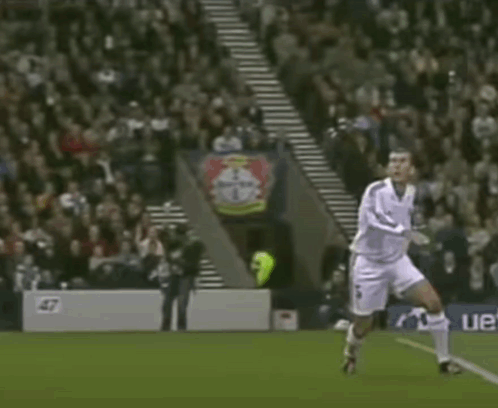 A Soccer Player Is Celebrating A Goal In Front Of A Bayer Banner GIF