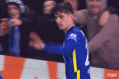 A Soccer Player Is Celebrating A Goal In Front Of A Crowd At A Soccer Game . GIF