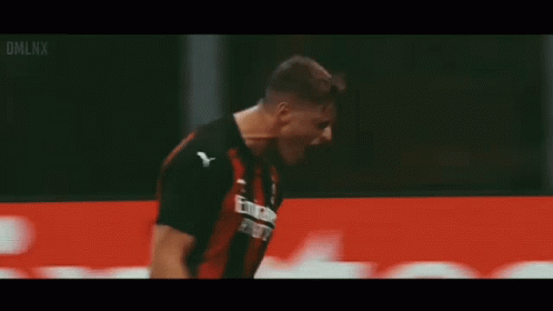 A Soccer Player Is Celebrating A Goal In Front Of A Fly Emirates Banner . GIF