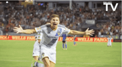 A Soccer Player Is Celebrating A Goal With His Arms Outstretched GIF