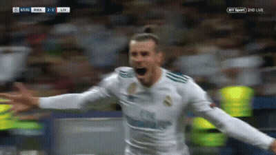 A Soccer Player Is Celebrating A Goal With His Arms Outstretched In Front Of A Crowd . GIF