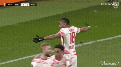 A Soccer Player Is Celebrating A Goal With His Teammates On A Soccer Field . GIF