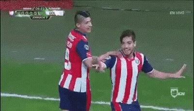 A Soccer Player Is Celebrating A Goal With His Teammates On The Field . GIF