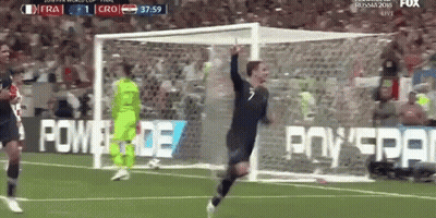 A Soccer Player Is Celebrating After Scoring A Goal During A Game GIF