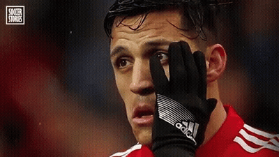 A Soccer Player Is Covering His Face With A Glove During A Match . GIF