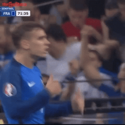 A Soccer Player Is Giving A Thumbs Up In Front Of A Crowd Of People . GIF