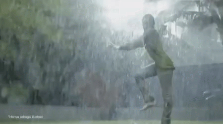 A Soccer Player Is Jumping In The Air In Front Of A Crowd GIF