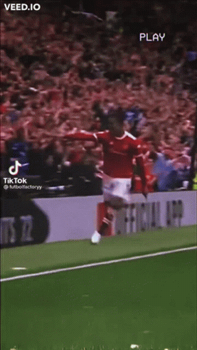 A Soccer Player Is Jumping In The Air On A Field . GIF