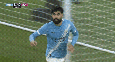 A Soccer Player Is Kicking A Ball During A Game Which Is Being Shown On A Television GIF