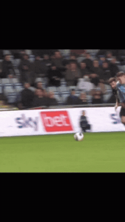A Soccer Player Is Kicking A Ball In Front Of A Sky Bet Banner GIF