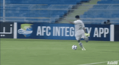 A Soccer Player Is Kicking A Ball In Front Of An Afc Integrity App Sign GIF
