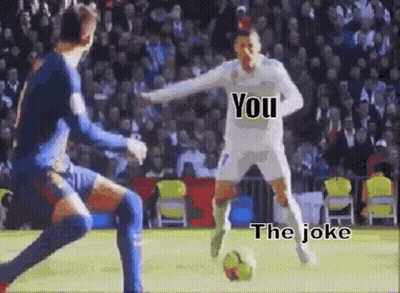A Soccer Player Is Kicking A Soccer Ball While Another Player Tries To Block Him . GIF