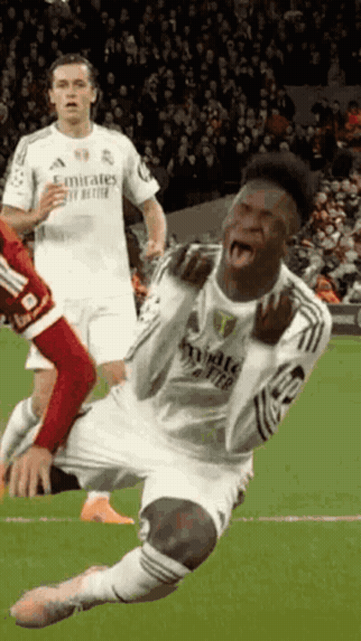 A Soccer Player Is Kneeling Down On The Field With His Mouth Open GIF