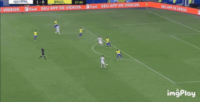 A Soccer Player Is Kneeling On The Field While Another Player Kicks The Ball . GIF