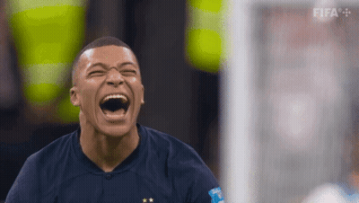 A Soccer Player Is Laughing While Wearing A Blue Shirt With Fifa Written On It GIF