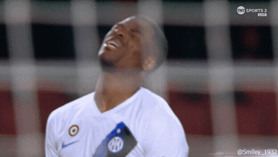 A Soccer Player Is Laughing While Wearing A White Shirt That Says Nike On It GIF