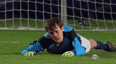 A Soccer Player Is Laying On The Field With A Byu Tv Logo In The Corner GIF