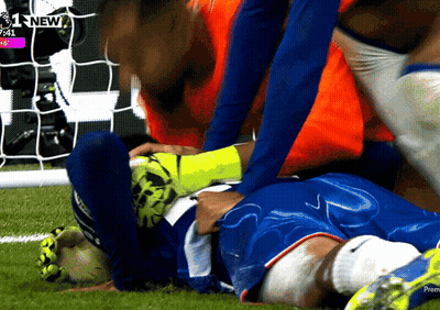 A Soccer Player Is Laying On The Field With The Time 7:41 On The Screen Behind Him GIF