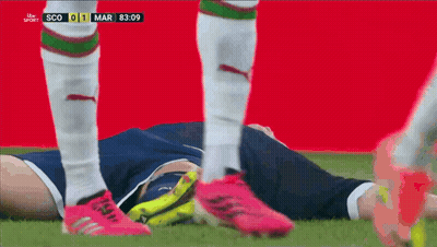 A Soccer Player Is Laying On The Ground During A Match Between Scotland And England GIF