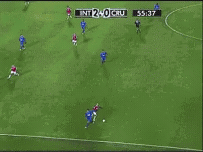 A Soccer Player Is Laying On The Ground In Front Of A Unimed Banner GIF