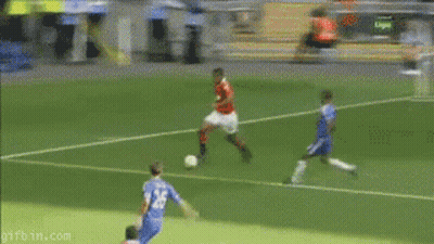 A Soccer Player Is Laying On The Ground In Front Of A Volunteers In Football Banner GIF