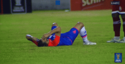 A Soccer Player Is Laying On The Ground With A Live Fc Logo In The Corner GIF