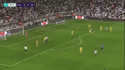 A Soccer Player Is Running On A Field During A Game . GIF