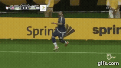 A Soccer Player Is Running On A Field In Front Of A Sprint Sign GIF