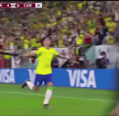 A Soccer Player Is Running On A Field In Front Of A Visa Ad GIF