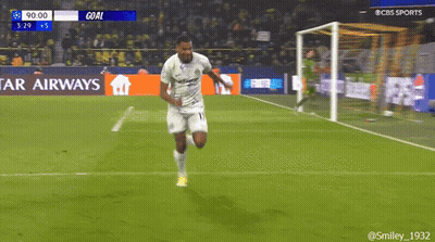 A Soccer Player Is Running On A Field With A Star Airways Banner In The Background GIF