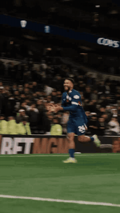 A Soccer Player Is Running On The Field In Front Of A Sign That Says Betmgmt GIF