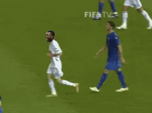 A Soccer Player Is Running On The Field With A Fifa Tv Advertisement In The Background GIF