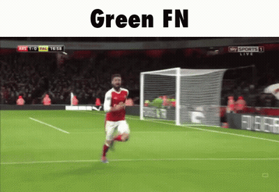 A Soccer Player Is Running On The Field With The Words Green Fn Written Above Him GIF
