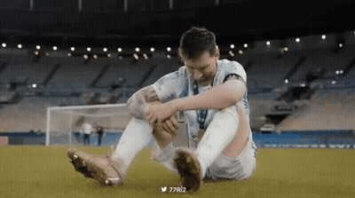 A Soccer Player Is Sitting On The Field With His Knee In Pain GIF