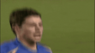 A Soccer Player Is Sitting On The Ground With A Playstation Sign In The Background GIF