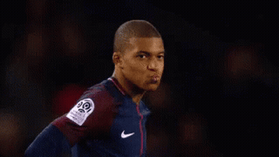 A Soccer Player Is Standing In Front Of A Sign That Says I Know . GIF