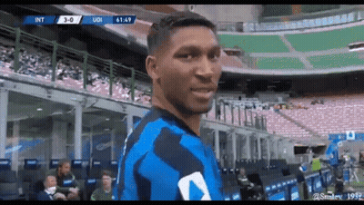 A Soccer Player Is Standing In The Stands Of A Stadium . GIF